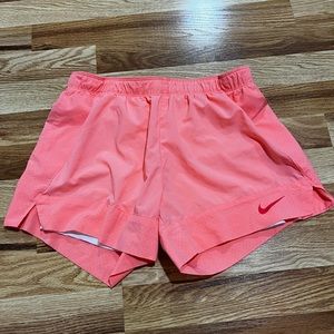 Medium hot pink nike shorts with built in white spandex